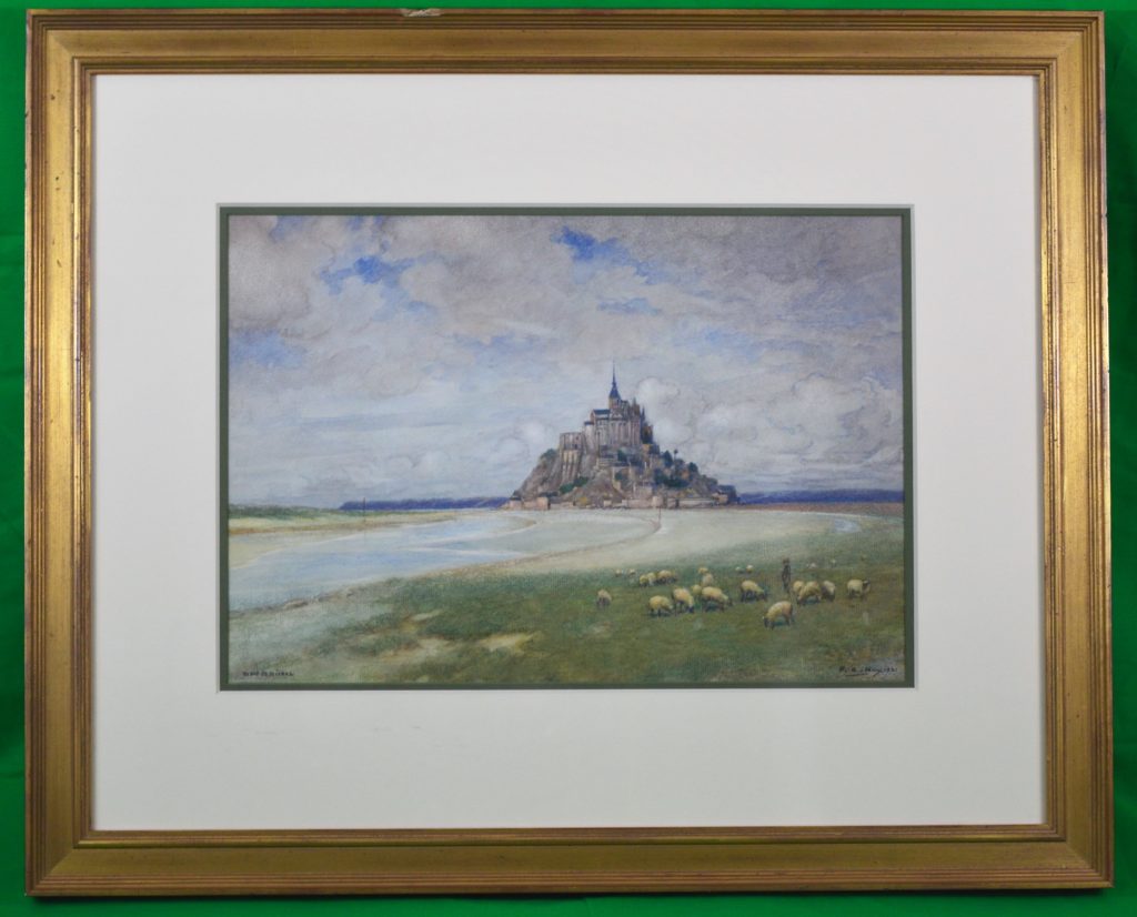 A framed watercolor of Mont St. Michel.